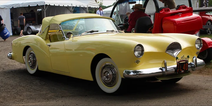 1954 Kaiser Darrin. Photograph by Kevauto, CC BY-SA 4.0. https://commons.wikimedia.org/wiki/File:1954_Kaiser_Darrin_front,_concours_6.1.19.jpg Fit to 2:1 with dark side borders.