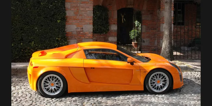 2012 Mastretta MXT. Photograph by Mastretta, Public domain. https://commons.wikimedia.org/wiki/File:Mastretta-MXT-lg.jpg Fit to 2:1 with dark side borders.