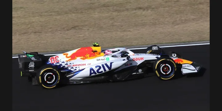 2025 Racing Bulls VCARB 02. Photograph by Liauzh, CC BY-SA 4.0. https://commons.wikimedia.org/wiki/File:2025_Japan_GP_-_Racing_Bulls_-_Liam_Lawson_-_FP2.jpg Fit to 2:1 with dark side borders.